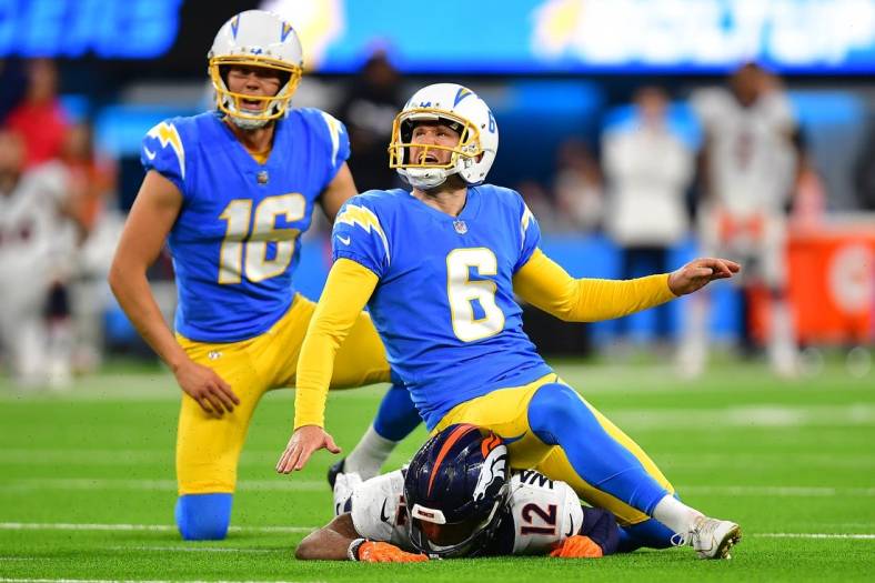 Oct 17, 2022; Inglewood, California, USA; Los Angeles Chargers place kicker Dustin Hopkins (6) kicks the game winning field goal against the Denver Broncos during overtime at SoFi Stadium. Mandatory Credit: Gary A. Vasquez-USA TODAY Sports