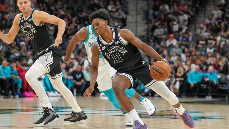 Oct 19, 2022; San Antonio, Texas, USA;  San Antonio Spurs guard Joshua Primo (11) dribbles the ball in the first half against the Charlotte Hornets at  the AT&T Center. Mandatory Credit: Daniel Dunn-USA TODAY Sports