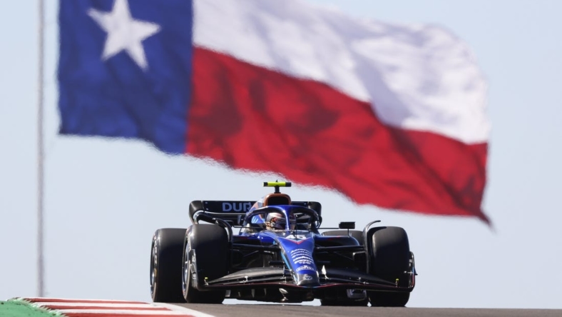 Oct 21, 2022; Austin, Texas, USA;  Williams Mercedes driver Logan Sargeant (45) passes the Texas flag during practice for the U.S. Grand Prix at Circuit of the Americas. Mandatory Credit: Erich Schlegel-USA TODAY Sports
