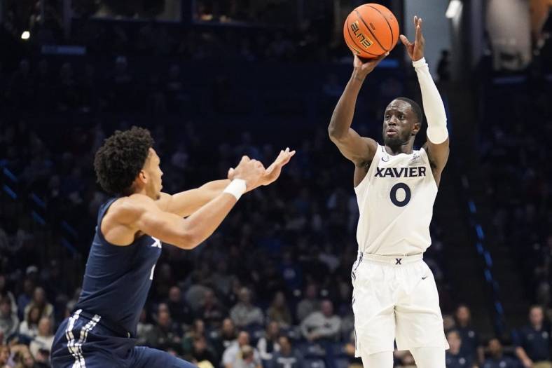 Xavier White guard Souley Boum (0) shoots in the first half of a scrimmage during Xavier Basketball        s Musketeer Madness on Friday, Oct. 21, 2022 at the Cintas Center in Cincinnati.

Ncaa Basketball Xavier Musketeer Madness