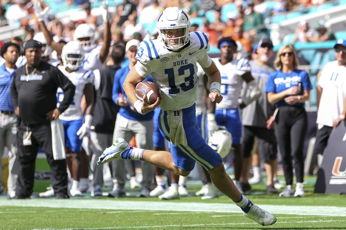 Oct 22, 2022; Miami Gardens, Florida, USA; Duke Blue Devils quarterback Riley Leonard (13) runs with the football for a touchdown during the fourth quarter against the Miami Hurricanes at Hard Rock Stadium. Mandatory Credit: Sam Navarro-USA TODAY Sports