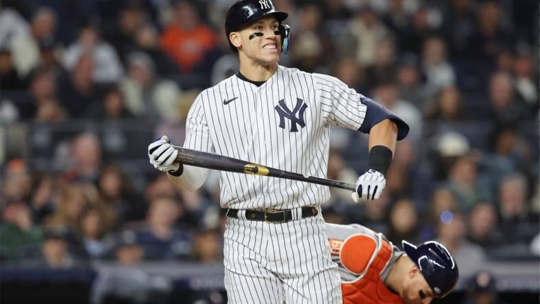 Oct 22, 2022; Bronx, New York, USA; New York Yankees right fielder Aaron Judge (99) reacts after striking out in the sixth inning against the Houston Astros during game three of the ALCS for the 2022 MLB Playoffs at Yankee Stadium. Mandatory Credit: Brad Penner-USA TODAY Sports