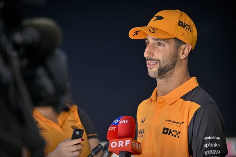 Oct 22, 2022; Austin, Texas, USA; McLaren F1 Team driver Daniel Ricciardo (3) of Team Australia is interviewed after the qualifying session for the U.S. Grand Prix at Circuit of the Americas. Mandatory Credit: Jerome Miron-USA TODAY Sports
