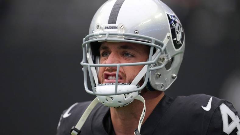 Oct 23, 2022; Paradise, Nevada, USA; Las Vegas Raiders quarterback Derek Carr (4) warms up before a game against the Houston Texans at Allegiant Stadium. Mandatory Credit: Stephen R. Sylvanie-USA TODAY Sports