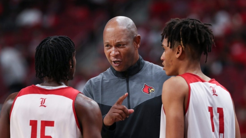 U of L head basketball coach Kenny Payne, center, instructed Hercy Miller (15)  and Fabio Basili (11) during their red/white scrimmage at the Yum Center in Louisville, Ky. on Oct. 23, 2022.

Uofl Scrimmage15 Sam