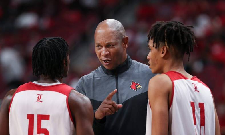 U of L head basketball coach Kenny Payne, center, instructed Hercy Miller (15)  and Fabio Basili (11) during their red/white scrimmage at the Yum Center in Louisville, Ky. on Oct. 23, 2022.

Uofl Scrimmage15 Sam