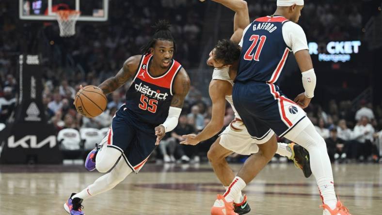 Oct 23, 2022; Cleveland, Ohio, USA; Washington Wizards guard Delon Wright (55) drives to the basket against as center Daniel Gafford (21) picks Cleveland Cavaliers guard Raul Neto (19) during the first half at Rocket Mortgage FieldHouse. Mandatory Credit: Ken Blaze-USA TODAY Sports