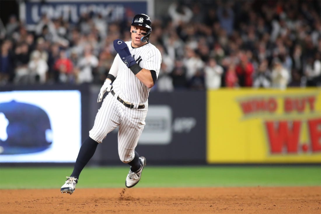 Oct 23, 2022; Bronx, New York, USA; New York Yankees center fielder Aaron Judge (99) rounds second base in the second inning against the Houston Astros during game four of the ALCS for the 2022 MLB Playoffs at Yankee Stadium. Mandatory Credit: Wendell Cruz-USA TODAY Sports