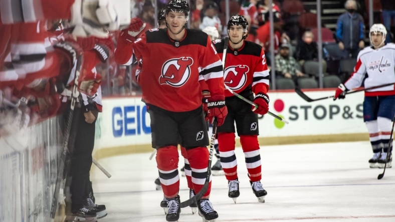 Oct 24, 2022; Newark, New Jersey, USA; New Jersey Devils right wing Nathan Bastian (14) reacts after scoring a goal against the Washington Capitals during the first period at Prudential Center. Mandatory Credit: John Jones-USA TODAY Sports