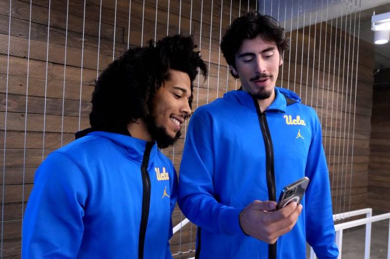 Oct 26, 2022; San Francisco, CA, USA; UCLA Bruins guard Tyger Campbell (left) and forward Jaime Jaquez Jr. react during Pac-12 Media Day at Pac-12 Network Studios. Mandatory Credit: Kirby Lee-USA TODAY Sports