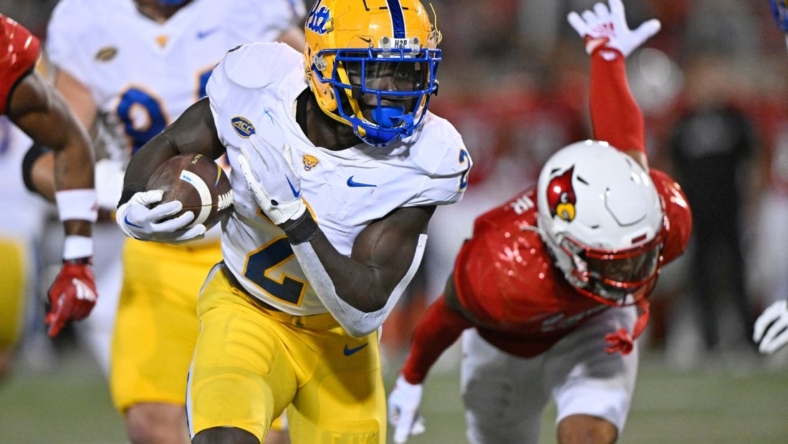 Oct 22, 2022; Louisville, Kentucky, USA;  Pittsburgh Panthers running back Israel Abanikanda (2) runs the ball against the Louisville Cardinals during the first half at Cardinal Stadium. Louisville defeated Pittsburgh 24-10. Mandatory Credit: Jamie Rhodes-USA TODAY Sports
