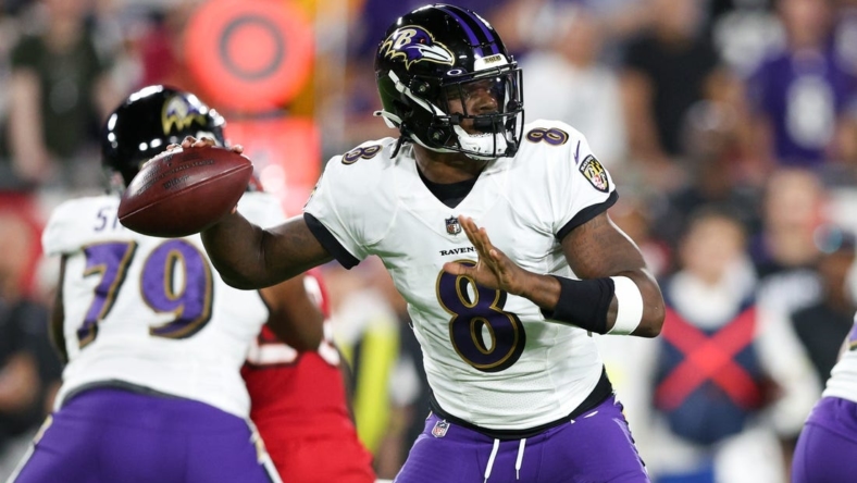 Oct 27, 2022; Tampa, Florida, USA;  Baltimore Ravens quarterback Lamar Jackson (8) drops back to pass against the Tampa Bay Buccaneers in the first quarter at Raymond James Stadium. Mandatory Credit: Nathan Ray Seebeck-USA TODAY Sports