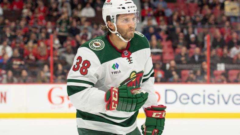 Oct 27, 2022; Ottawa, Ontario, CAN; Minnesota Wild right wing Ryan Hartman (38) skates to the bench following his goal in the second period against the Ottawa Senators at the Canadian Tire Centre. Mandatory Credit: Marc DesRosiers-USA TODAY Sports