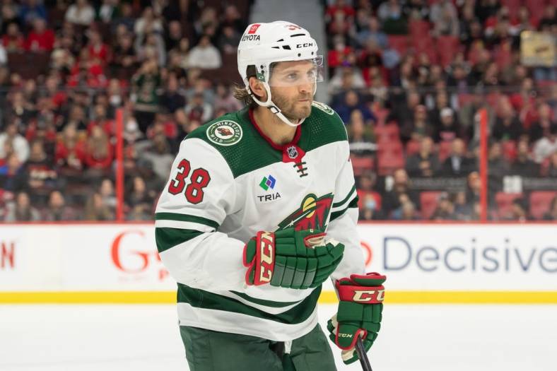 Oct 27, 2022; Ottawa, Ontario, CAN; Minnesota Wild right wing Ryan Hartman (38) skates to the bench following his goal in the second period against the Ottawa Senators at the Canadian Tire Centre. Mandatory Credit: Marc DesRosiers-USA TODAY Sports