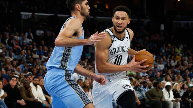 Oct 24, 2022; Memphis, Tennessee, USA; Brooklyn Nets guard Ben Simmons (10) drives to the basket as Memphis Grizzlies forward Santi Aldama (7) defends during the second half at FedExForum. Mandatory Credit: Petre Thomas-USA TODAY Sports