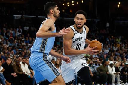 Oct 24, 2022; Memphis, Tennessee, USA; Brooklyn Nets guard Ben Simmons (10) drives to the basket as Memphis Grizzlies forward Santi Aldama (7) defends during the second half at FedExForum. Mandatory Credit: Petre Thomas-USA TODAY Sports