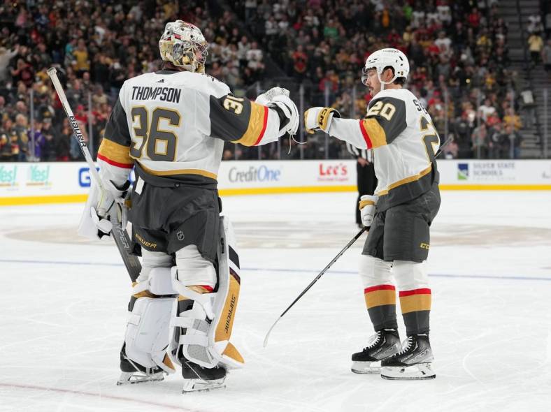 Oct 28, 2022; Las Vegas, Nevada, USA; Vegas Golden Knights center Chandler Stephenson (20) celebrates with Vegas Golden Knights goaltender Logan Thompson (36) after scoring a goal against the Anaheim Ducks during the first period at T-Mobile Arena. Mandatory Credit: Stephen R. Sylvanie-USA TODAY Sports