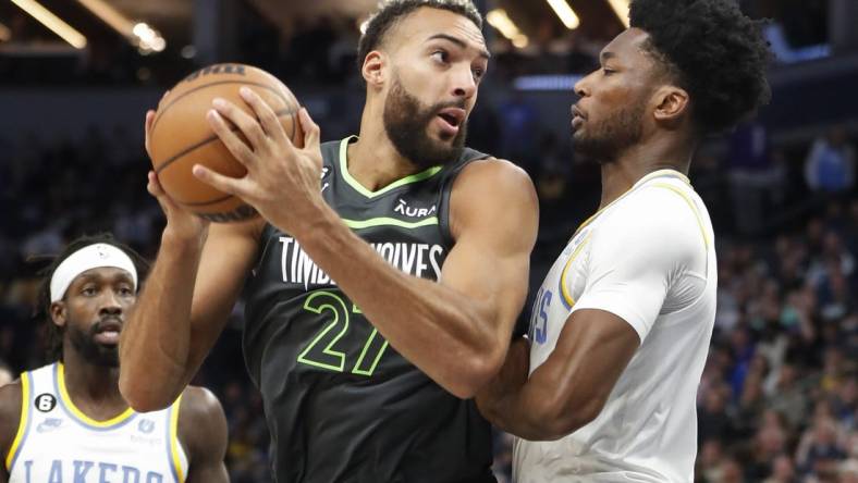 Oct 28, 2022; Minneapolis, Minnesota, USA; Minnesota Timberwolves center Rudy Gobert (27) works against Los Angeles Lakers center Damian Jones (30) in the first quarter at Target Center. Mandatory Credit: Bruce Kluckhohn-USA TODAY Sports