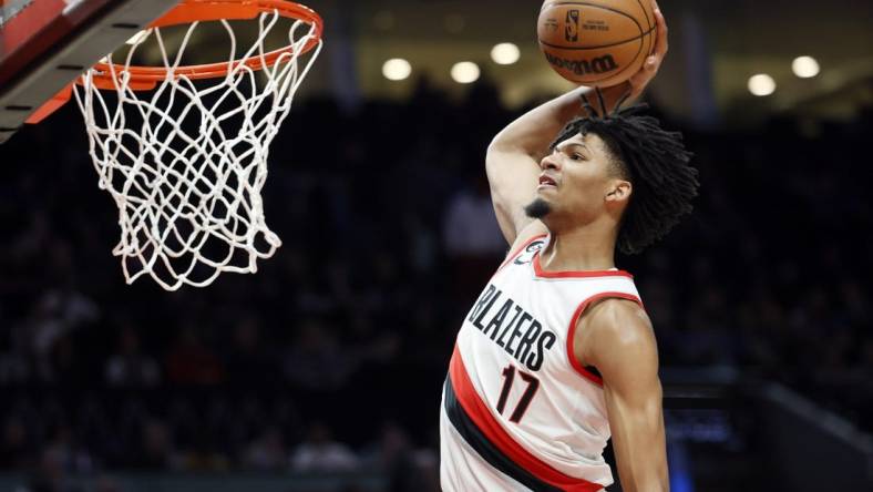 Oct 28, 2022; Portland, Oregon, USA; Portland Trail Blazers shooting guard Shaedon Sharpe (17) goes up for a dunk against the Houston Rockets during the first half at Moda Center. Mandatory Credit: Soobum Im-USA TODAY Sports