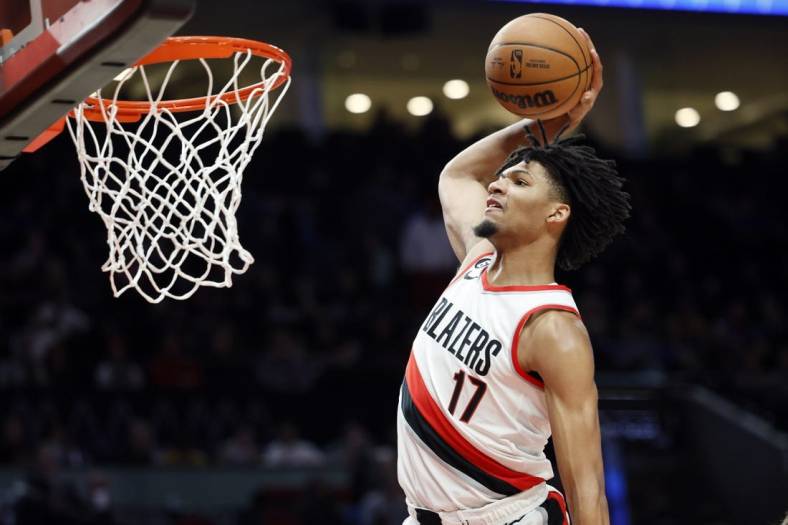 Oct 28, 2022; Portland, Oregon, USA; Portland Trail Blazers shooting guard Shaedon Sharpe (17) goes up for a dunk against the Houston Rockets during the first half at Moda Center. Mandatory Credit: Soobum Im-USA TODAY Sports