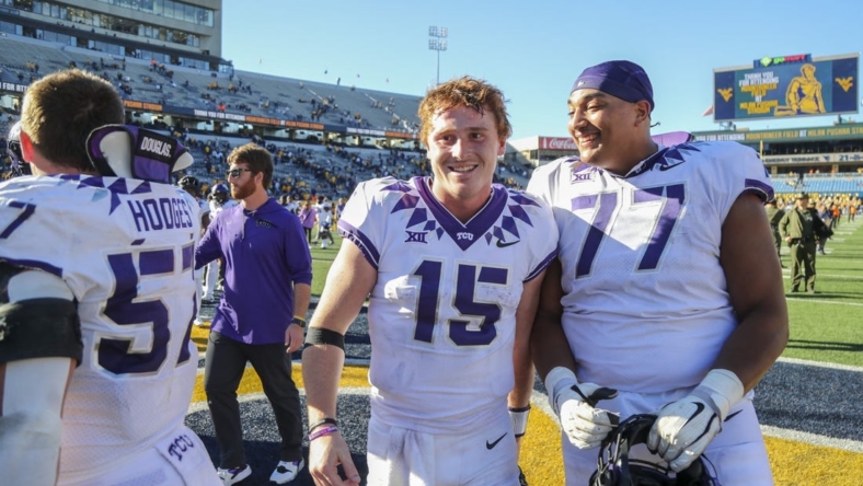 Oct 29, 2022; Morgantown, West Virginia, USA; TCU Horned Frogs quarterback Max Duggan (15) celebrates with teammates after defeating the West Virginia Mountaineers at Mountaineer Field at Milan Puskar Stadium. Mandatory Credit: Ben Queen-USA TODAY Sports