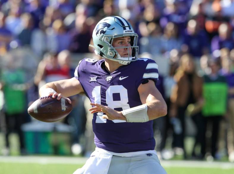 Oct 29, 2022; Manhattan, Kansas, USA; Kansas State Wildcats quarterback Will Howard (18) drops back to pass during the first quarter against the Oklahoma State Cowboys at Bill Snyder Family Football Stadium. Mandatory Credit: Scott Sewell-USA TODAY Sports