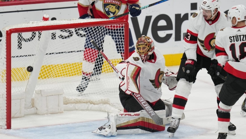 Oct 29, 2022; Sunrise, Florida, USA;  Ottawa Senators goaltender Anton Forsberg (31) looks back at a goal scored by Florida Panthers defenseman Brandon Montour (62) to give the Panthers a 4-3 lead in the third period at FLA Live Arena. Mandatory Credit: Jim Rassol-USA TODAY Sports