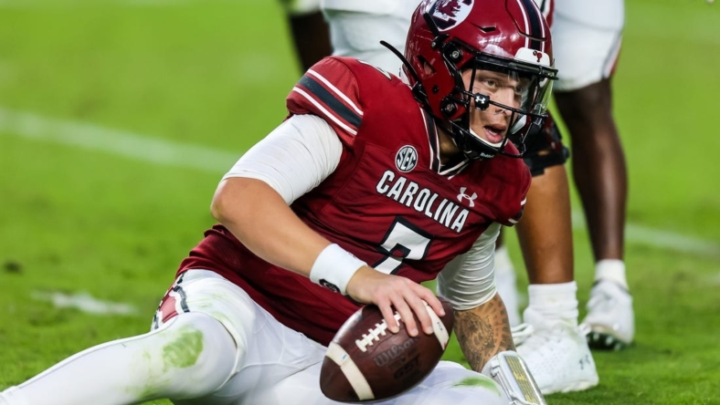 Oct 29, 2022; Columbia, South Carolina, USA; South Carolina Gamecocks quarterback Spencer Rattler (7) reacts after being sacked by the Missouri Tigers in the second half at Williams-Brice Stadium. Mandatory Credit: Jeff Blake-USA TODAY Sports