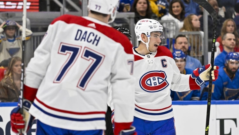 Oct 29, 2022; St. Louis, Missouri, USA;  Montreal Canadiens center Nick Suzuki (14) reacts after scoring against the St. Louis Blues during the first period at Enterprise Center. Mandatory Credit: Jeff Curry-USA TODAY Sports