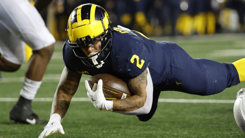 Oct 29, 2022; Ann Arbor, Michigan, USA; Michigan Wolverines running back Blake Corum (2) rushes for a touchdown in the first half against the Michigan State Spartans at Michigan Stadium. Mandatory Credit: Rick Osentoski-USA TODAY Sports