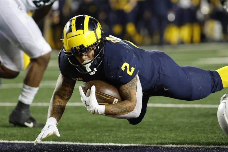 Oct 29, 2022; Ann Arbor, Michigan, USA; Michigan Wolverines running back Blake Corum (2) rushes for a touchdown in the first half against the Michigan State Spartans at Michigan Stadium. Mandatory Credit: Rick Osentoski-USA TODAY Sports