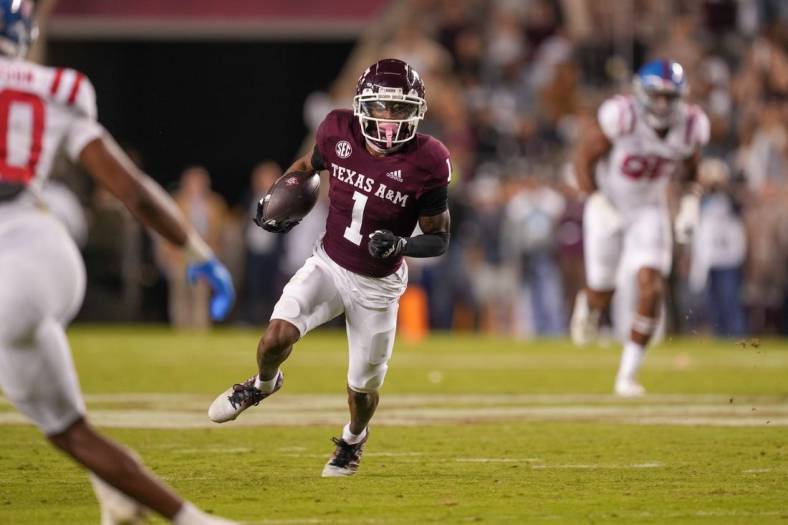 Oct 29, 2022; College Station, Texas, USA;  Texas A&M Aggies wide receiver Evan Stewart (1) runs the ball against the Mississippi Rebels in the second half at Kyle Field. Mandatory Credit: Daniel Dunn-USA TODAY Sports
