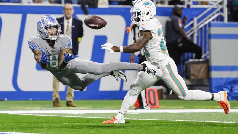 Oct 30, 2022; Detroit, Michigan, USA;  Detroit Lions wide receiver Josh Reynolds (8) tries to make a catch against Miami Dolphins cornerback Kader Kohou (28) during the second half at Ford Field. Mandatory Credit: Junfu Han-USA TODAY Sports