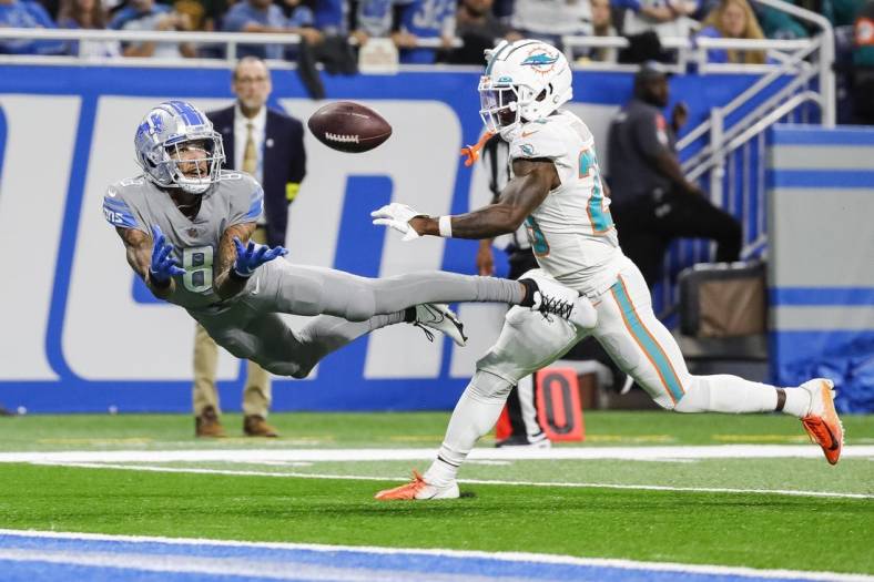 Oct 30, 2022; Detroit, Michigan, USA;  Detroit Lions wide receiver Josh Reynolds (8) tries to make a catch against Miami Dolphins cornerback Kader Kohou (28) during the second half at Ford Field. Mandatory Credit: Junfu Han-USA TODAY Sports