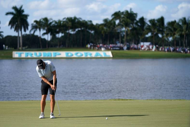 Oct 30, 2022; Miami, Florida, USA; Peter Uihlein putts on the 18th green during the final round of the season finale of the LIV Golf series at Trump National Doral. Mandatory Credit: Jasen Vinlove-USA TODAY Sports