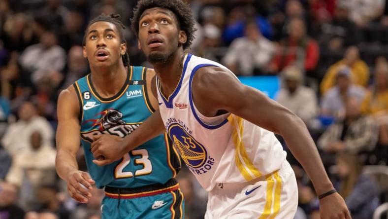 Oct 30, 2022; Detroit, Michigan, USA; Golden State Warriors center James Wiseman (33) blocks out Detroit Pistons guard Jaden Ivey (23) after a free throw during  the second half at Little Caesars Arena. Mandatory Credit: David Reginek-USA TODAY Sports