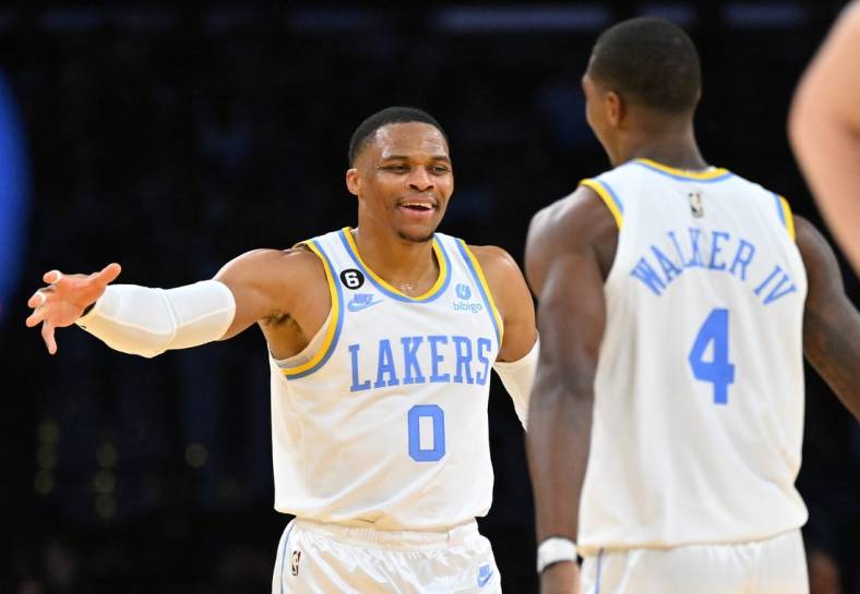 Oct 30, 2022; Los Angeles, California, USA;  Los Angeles Lakers guard Russell Westbrook (0) celebrates with guard Lonnie Walker IV (4) after a 3 point basket in the second half against the Denver Nuggets at Crypto.com Arena. Mandatory Credit: Jayne Kamin-Oncea-USA TODAY Sports