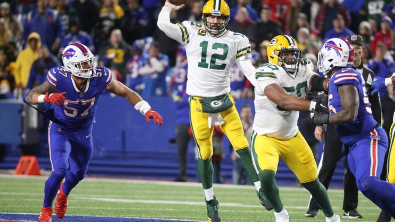The Packers' Aaron Rodgers  makes a jump pass against the Bills.