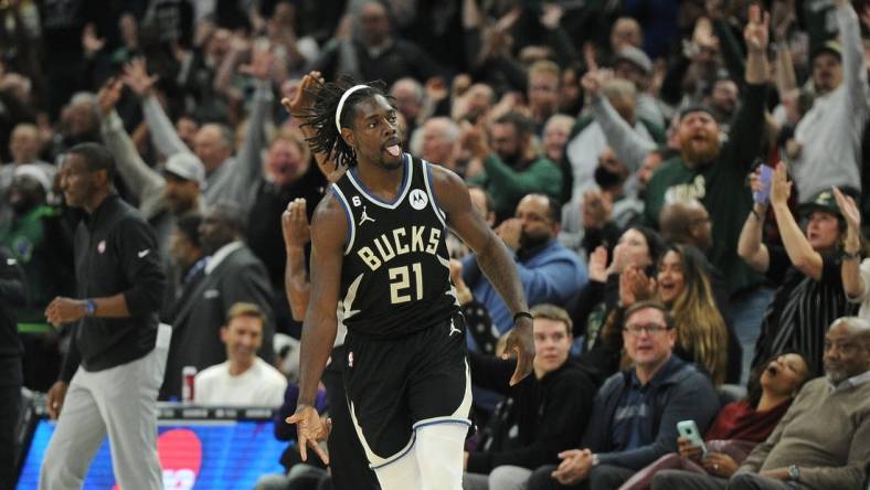 Oct 31, 2022; Milwaukee, Wisconsin, USA; Milwaukee Bucks guard Jrue Holiday (21) celebrates after a three-point basket in the fourth quarter against the Detroit Pistons at Fiserv Forum. Mandatory Credit: Michael McLoone-USA TODAY Sports