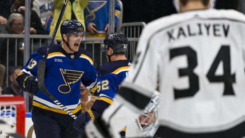 Oct 31, 2022; St. Louis, Missouri, USA; St. Louis Blues right wing Alexey Toropchenko (13) reacts after scoring against the Los Angeles Kings during the second period at Enterprise Center. Mandatory Credit: Jeff Curry-USA TODAY Sports