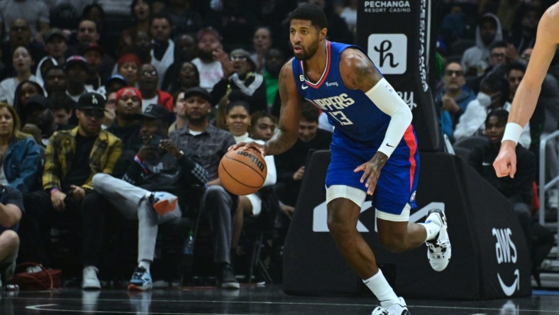 Oct 31, 2022; Los Angeles, California, USA; LA Clippers guard Paul George (13) dribbles down court in the first half against the Houston Rockets at Crypto.com Arena. Mandatory Credit: Richard Mackson-USA TODAY Sports