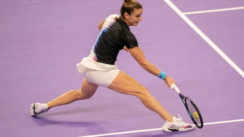 Oct 31, 2022; Forth Worth, TX, USA; Maria Sakkari (GRE) returns a shot during her match against Jessica Pegula (USA) on day one of the WTA Finals at Dickies Arena. Mandatory Credit: Susan Mullane-USA TODAY Sports