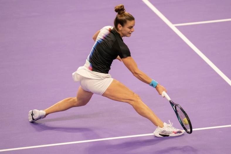 Oct 31, 2022; Forth Worth, TX, USA; Maria Sakkari (GRE) returns a shot during her match against Jessica Pegula (USA) on day one of the WTA Finals at Dickies Arena. Mandatory Credit: Susan Mullane-USA TODAY Sports