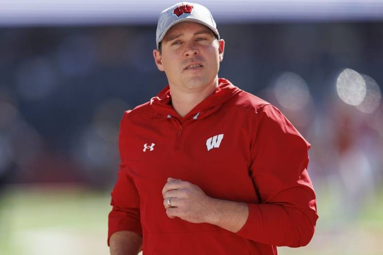 Oct 22, 2022; Madison, Wisconsin, USA;  Wisconsin Badgers head coach Jim Leonhard during warmups prior to the game against the Purdue Boilermakers at Camp Randall Stadium. Mandatory Credit: Jeff Hanisch-USA TODAY Sports