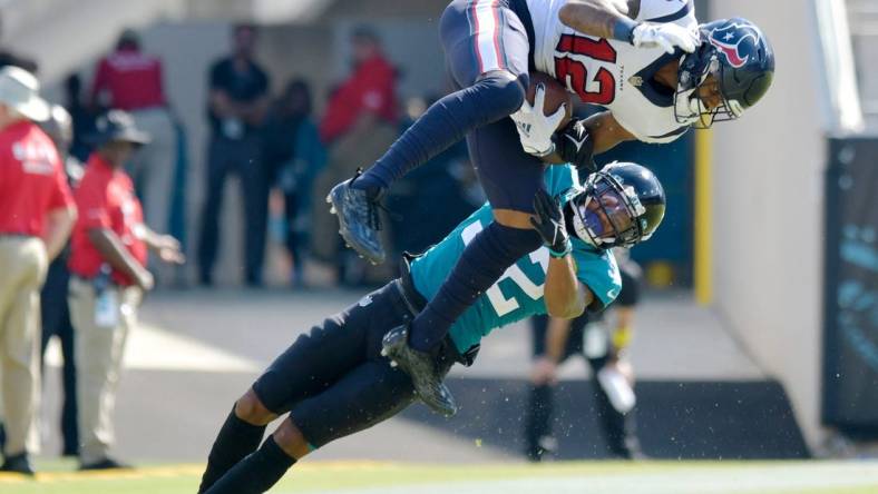 Jacksonville Jaguars cornerback Tyson Campbell (32) tries to defend a pass play against Houston Texans wide receiver Nico Collins (12) during fourth quarter action. Campbell was penalized for pass interference on the play. The Jacksonville Jaguars hosted the Houston Texans at TIAA Bank Field in Jacksonville, FL Sunday, October 9, 2022. The Jaguars fell to the Texans with a final score of 13 to 6.

Jki 101022 Bs Jaguars Vs Texans 20