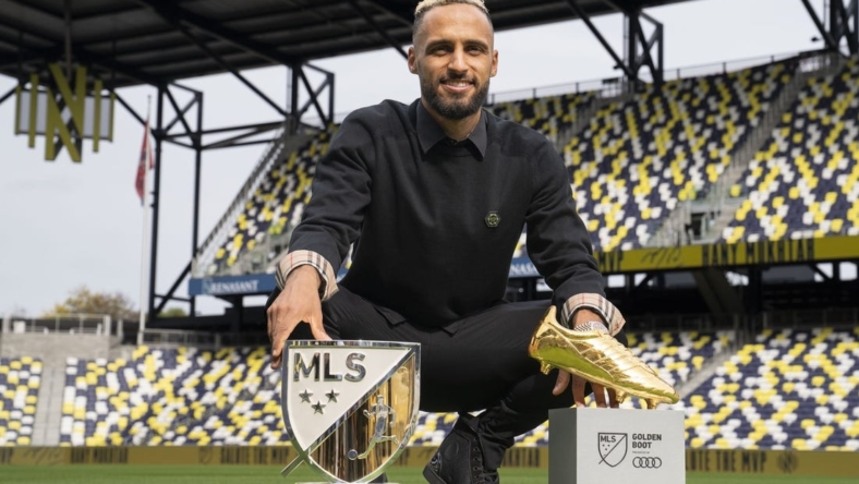 Nov 1, 2022; Nashville, Tennessee, USA;Nashville SC's Hany Mukhtar poses with his Landon Donovan MLS MVP and MLS Golden Boot awards on the field at Geodis Park.  Mandatory Credit: George Walker IV - USA TODAY Sports
