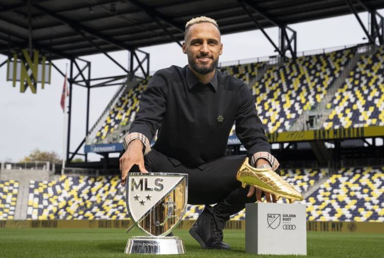Nov 1, 2022; Nashville, Tennessee, USA;
Nashville SC's Hany Mukhtar poses with his Landon Donovan MLS MVP and MLS Golden Boot awards on the field at Geodis Park.  Mandatory Credit: George Walker IV - USA TODAY Sports