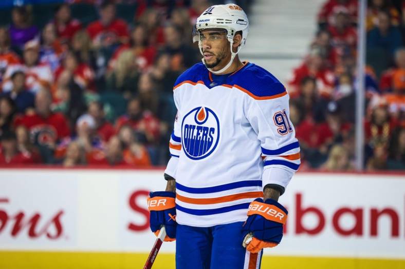 Oct 29, 2022; Calgary, Alberta, CAN; Edmonton Oilers left wing Evander Kane (91) against the Calgary Flames during the first period at Scotiabank Saddledome. Mandatory Credit: Sergei Belski-USA TODAY Sports