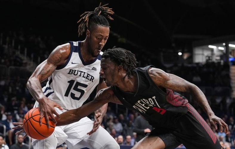 Butler Bulldogs center Manny Bates (15) grabs the ball from Davenport Panthers Marcedus Leech Jr. (5) on Tuesday, Nov. 1, 2022, at Hinkle Fieldhouse in Indianapolis. The Butler Bulldogs lead at the half agains the Davenport Panthers.

Ncaa Basketball Butler Basketball Vs Davenport Exhibition Davenport At Butler Bulldogs