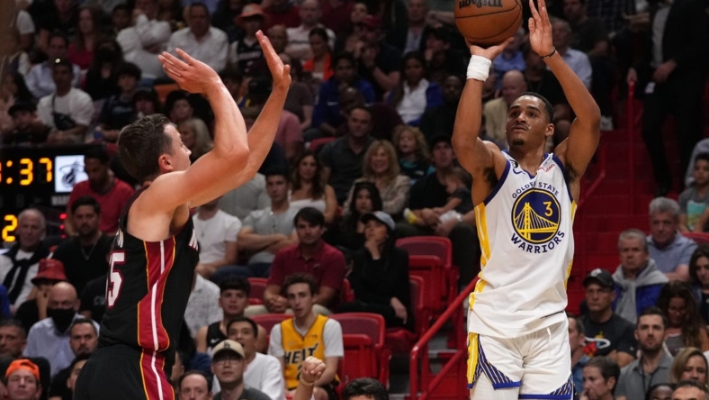Nov 1, 2022; Miami, Florida, USA; Golden State Warriors guard Jordan Poole (3) attempts a three point shot on Miami Heat guard Duncan Robinson (55) during the first half at FTX Arena. Mandatory Credit: Jasen Vinlove-USA TODAY Sports